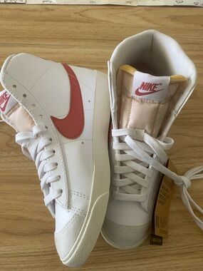 Nike Women’s White High-Top Sneakers with Coral Swoosh